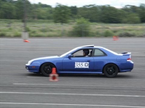 2001 Mercury Grand Marquis - A blue coupe navigates a course marked by orange cones on a paved track.