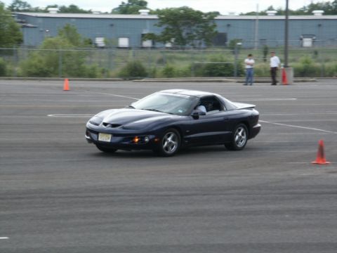 2001 Mercury Grand Marquis - A dark blue coupe navigates a course marked by orange cones.