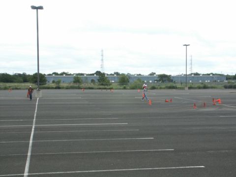 2001 Mercury Grand Marquis - An empty parking lot is set up with cones, suggesting a driving course or event.