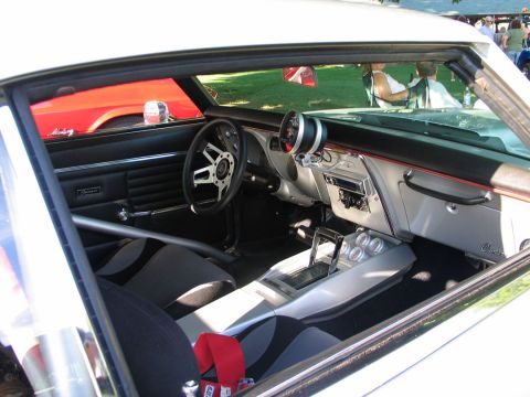 1994 Ford Bronco - Interior view of a modified car with racing seats and custom dashboard elements.