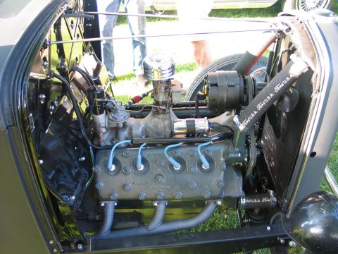1994 Ford Bronco - Close-up view of a Ford engine, hoses marked "Ford U.S.A." and custom exhaust headers.