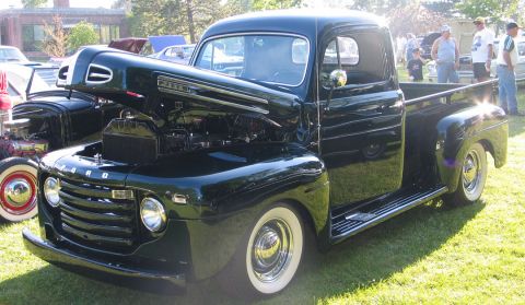 1994 Ford Bronco - This classic Ford pickup truck has its hood open, revealing the engine bay.
