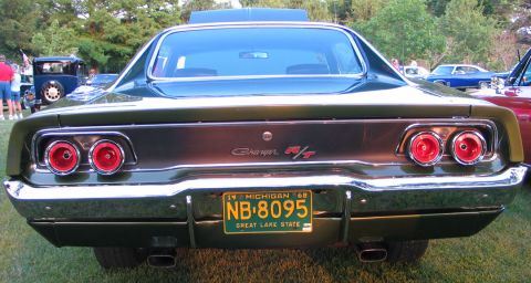 1994 Ford Bronco - Rear view of a green 1968 Dodge Charger R/T, identified by its R/T badge and distinctive taillights.
