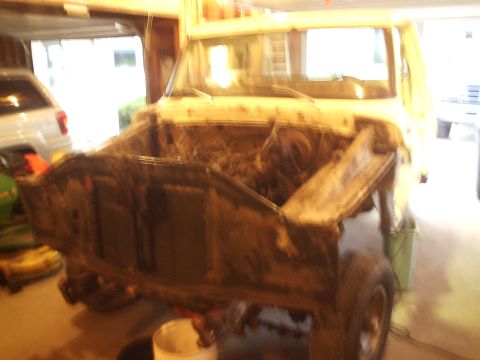 1979 Ford F-150 - Front view of a 1979 Ford F-150 with its hood off, revealing the engine compartment and surrounding bodywork.