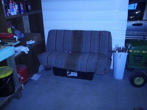1979 Ford F-150 - Bench seat and lawn tractor in a garage setting.