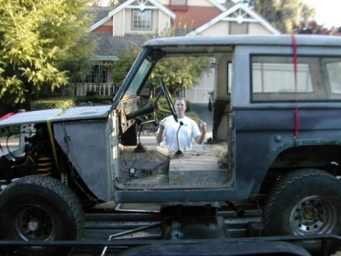 1971 Ford Bronco - A partially disassembled 1971 Ford Bronco sits on a trailer, ready for its next stage of restoration.