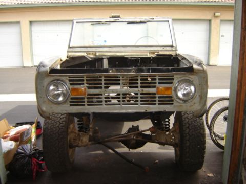 1971 Ford Bronco - This 1971 Ford Bronco is shown from the front with its hood open, revealing the engine bay and front clip.
