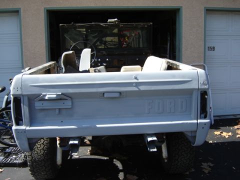 1971 Ford Bronco - Rear view of a 1971 Ford Bronco, showing the tailgate with embossed 'FORD' lettering and the overall body style.