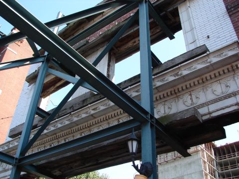 1992 Ford Taurus - Construction site shows steel framework against a backdrop of an old building's facade.