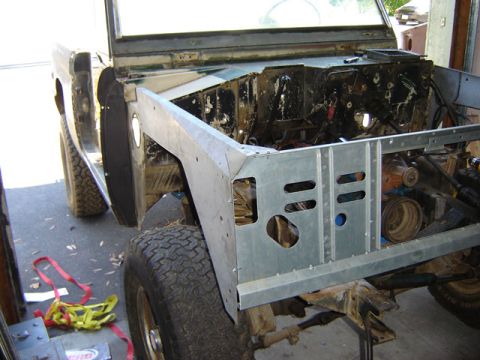 1971 Ford Bronco - This 1966 Ford Bronco is undergoing front clip repair, revealing its engine and chassis components.
