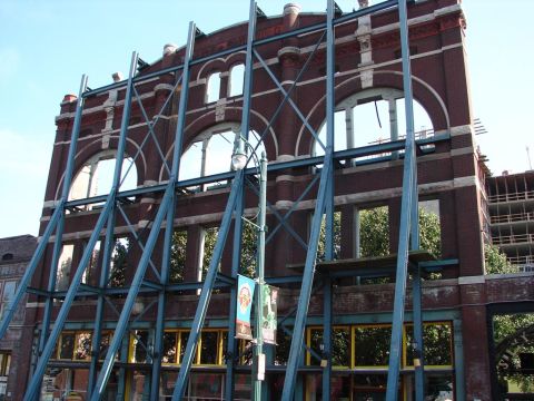 1992 Ford Taurus - Building undergoing structural reinforcement and construction, with scaffolding obscuring facade.