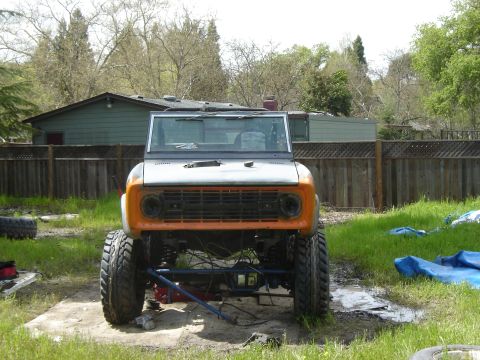 1971 Ford Bronco - Front view of a lifted 1971 Ford Bronco with an orange grille.