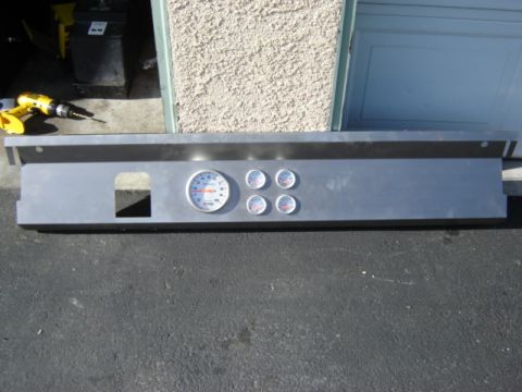 1971 Ford Bronco - This aluminum dash panel features a tachometer and three auxiliary gauges, likely for a custom vehicle build.