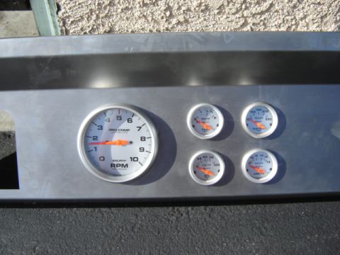 1971 Ford Bronco - Aftermarket dashboard gauge cluster a tachometer and auxiliary gauges.