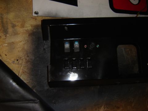 1971 Ford Bronco - A black dashboard panel with multiple switches is shown, possibly for aftermarket modifications.