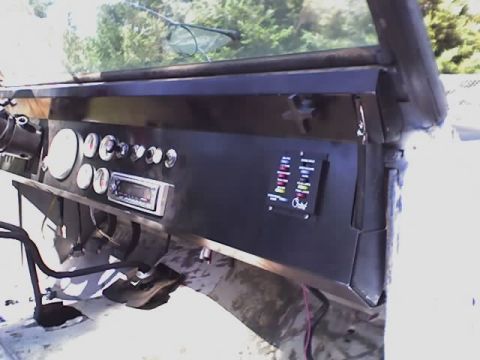 1971 Ford Bronco - Interior view of a vehicle's dashboard with various gauges and a fuse panel.