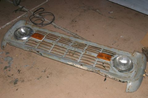 1971 Ford Bronco - This is a grille assembly with integrated headlights and amber turn signals, likely a replacement part.