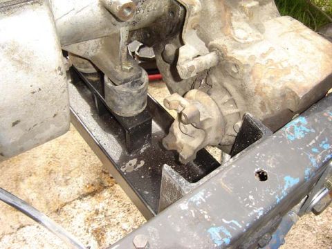 1971 Ford Bronco - Drivetrain component, possibly transmission or transfer case, attached to a vehicle's frame.