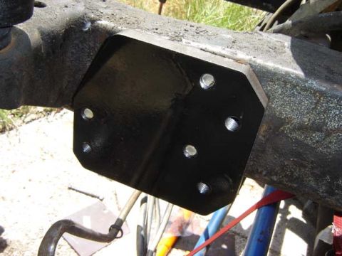 1971 Ford Bronco - Close-up of a steering component mount attached to a vehicle frame.