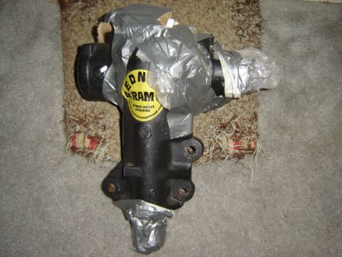 1971 Ford Bronco - Steering gear box part, wrapped in plastic and tape, with a RED-RAM sticker.