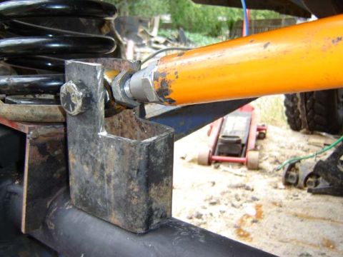 1971 Ford Bronco - Close-up view of a vehicle's suspension system, focusing on the track bar mount.