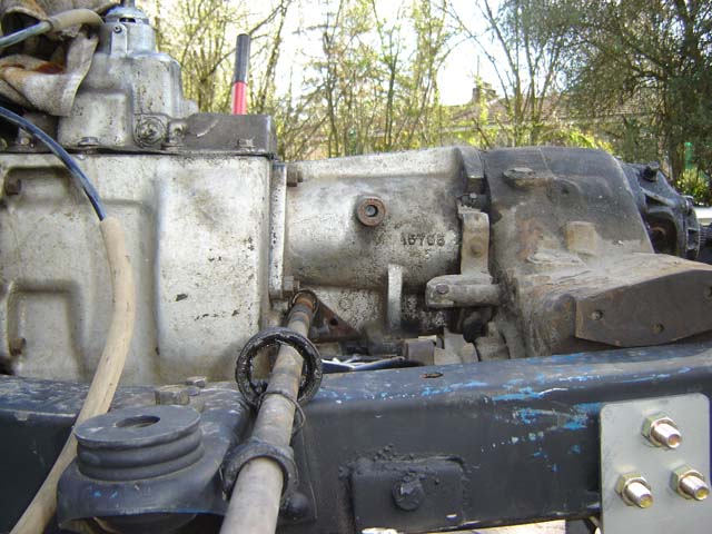Aluminum transmission and transfer case in a bare frame with driveshaft and crossmember