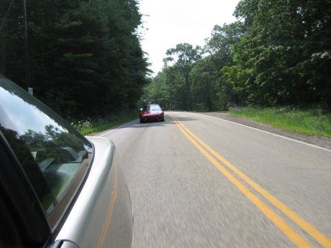 1995 Ford Probe - Driving on a country road with another car ahead.