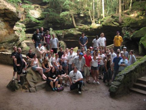 1995 Ford Probe - A large group of people pose for a photo in a scenic outdoor canyon environment.
