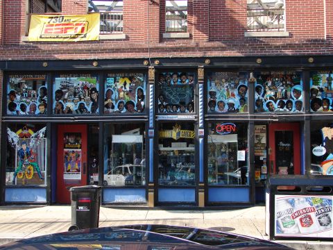 1992 Ford Taurus - A white sedan is parked inside a store, visible through the front window.