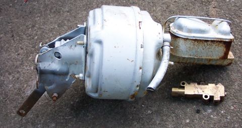 1978 Ford Bronco - Brake booster, master cylinder, and proportioning valve assembly shown on a concrete surface.