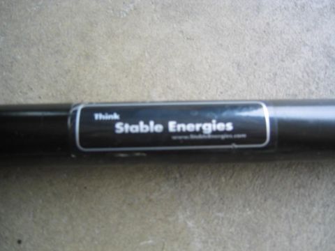 1993 Ford Probe - A close-up of a black bar with a sticker that says "Think Stable Energies" and a website.