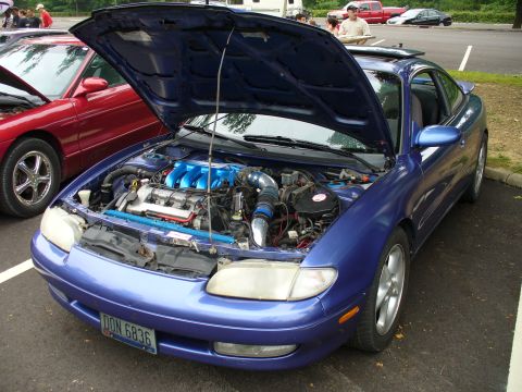 1991 Ford Probe - Blue coupe with hood open, revealing the engine bay. The license plate reads DON 6836.
