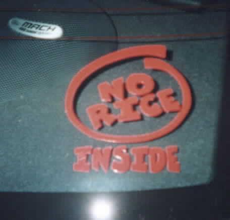 2001 Ford Mustang - A red decal with the words "NO RICE INSIDE" is affixed to a car's interior surface.
