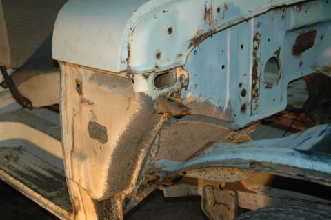 1963 Ford F-250 - This image shows the inner fender well and part of the frame of a truck, with visible rust and wear.