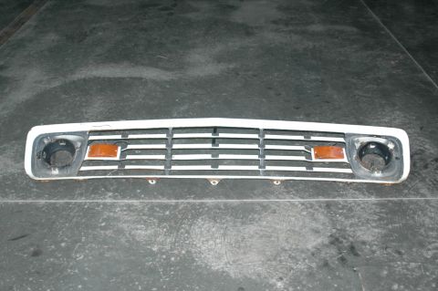 1963 Ford F-250 - Front grille assembly for a 1963 Ford F-250, horizontal bars and amber turn signal indicators.