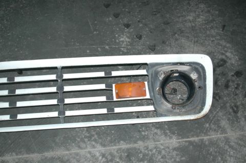 1963 Ford F-250 - Grille assembly from a 1963 Ford F-250 truck, showing the headlight opening and turn signal.