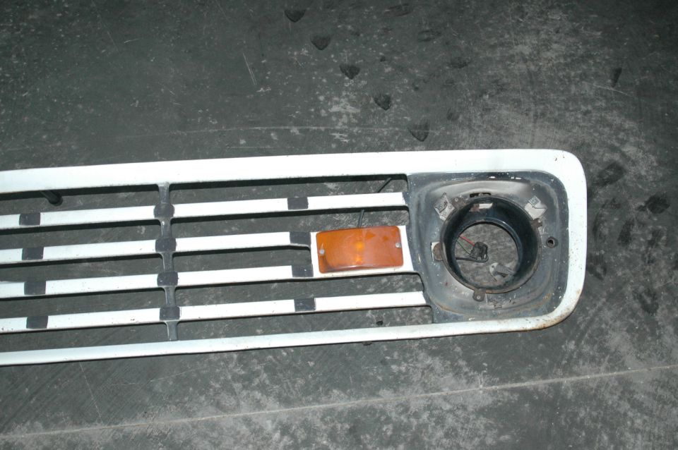 1963 Ford F-250 grille with amber turn signal and headlight bucket