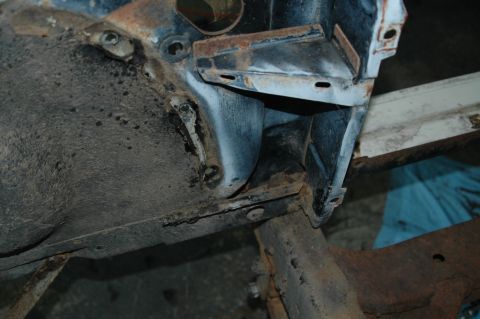 1963 Ford F-250 - Detail of a disassembled truck's frame and fender well, showing rust and wear.