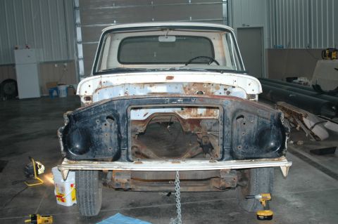 1963 Ford F-250 - This truck's front end is disassembled, showing the frame and engine bay area.