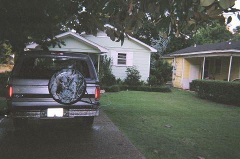 1995 Ford Bronco - This 1995 Ford Bronco is parked in a driveway in front of a residential home.