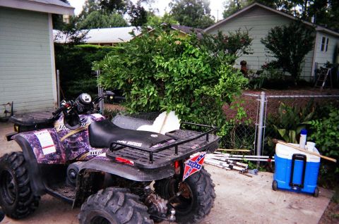 1995 Ford Bronco - This ATV features a unique purple camouflage pattern and a prominent Confederate flag decal on its rear fender.