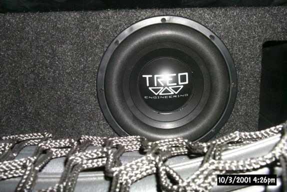 TREO Engineering subwoofer in gray carpeted enclosure with cargo net