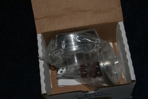 1989 Ford Crown Victoria LTD - A metal automotive part is shown packaged inside its original box.