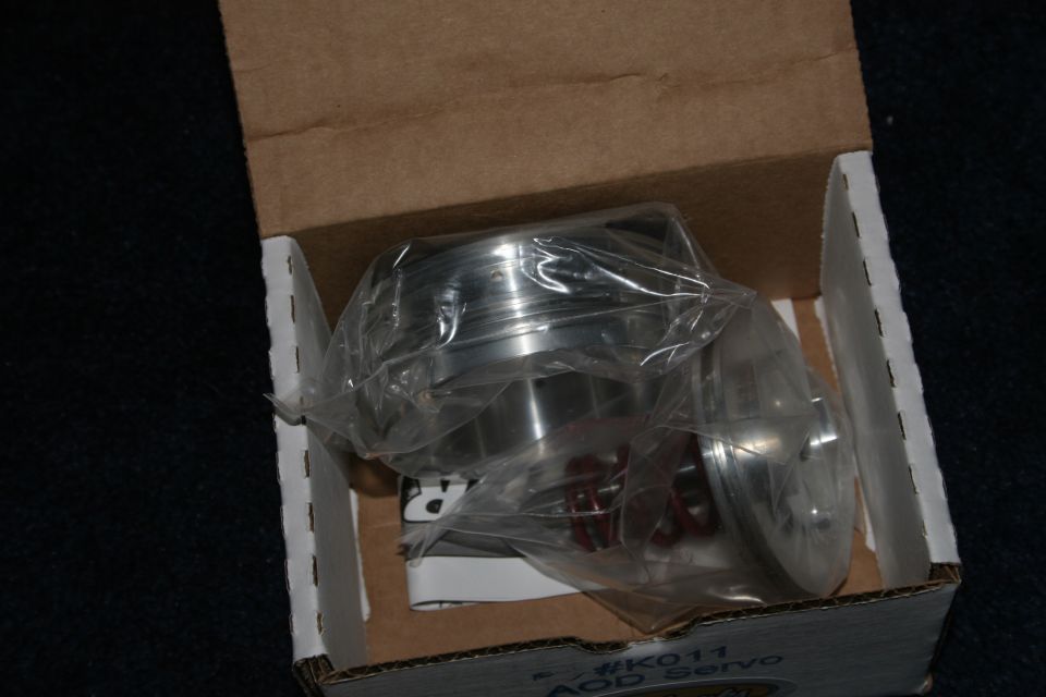New-in-box AOD transmission servo kit, aluminum pistons in plastic bags, box marked #K011 AOD Servo