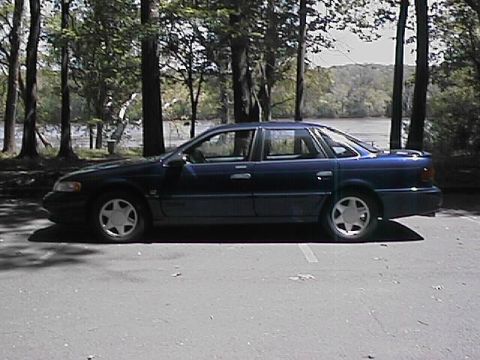 1993 Ford Taurus - This sedan's body style suggests a mid-1990s model, likely not a 1993 Ford Taurus.
