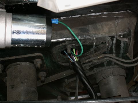1983 Ford Bronco - nice neat harness into engine bay inside tubing....no grommets in firewall yet...compressor for air horns to left of wiring