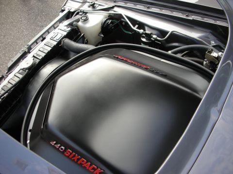 1998 Ford Crown Victoria - black air cleaner assembly stamped 440 SIX PACK sits atop the engine in a muscle car engine bay.