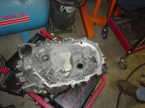 1995 Ford Probe - Close-up of a disassembled transmission casing, showing internal gears and mechanisms.