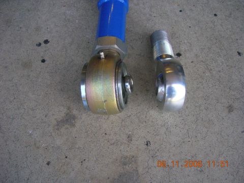 1996 Ford Bronco - Comparison of two different rod ends, one with a blue coating and the other polished metal.