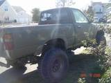 1992 Toyota Tacoma - A camouflaged pickup truck is seen from the rear three-quarter angle. A date stamp on the image reads 2009.